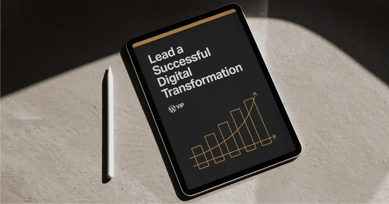 Tablet with Lead a Successful Digital Transformation and a stylus on a concrete surface.