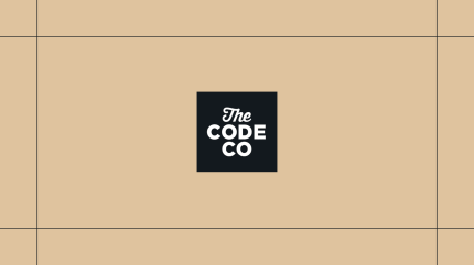 Black The Code Company logo on a gold background, framed by thin black lines.