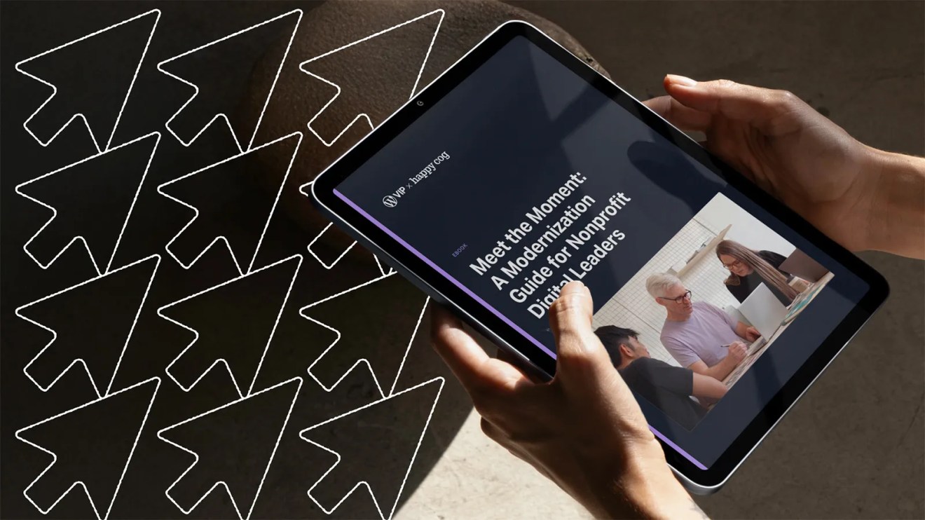 Tablet displaying a nonprofit digital transformation leaders guide, held by hands, with cursor icons in the background.