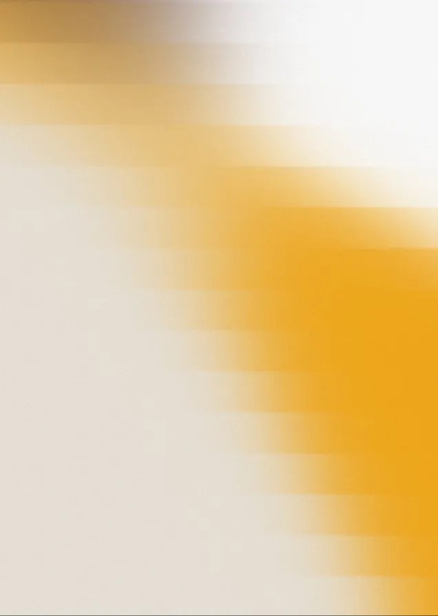 Blurry gradient with white and yellow-orange diagonal streaks blending across the image.