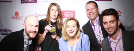Five people smiling at a digital solution event, highlighting community and publishing collaboration.
