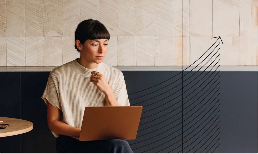 Person working on a laptop with an upward growth graphic overlay, representing content performance, scalability, and continuous optimization across WordPress VIP capabilities.