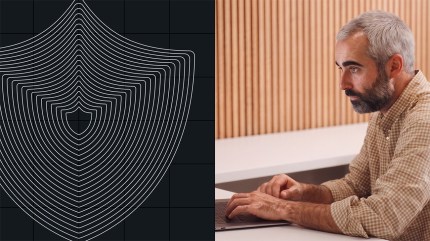 A man uses a laptop next to a graphic of layered shield outlines on a black background, symbolizing the importance of CISO buy-in for robust cybersecurity.