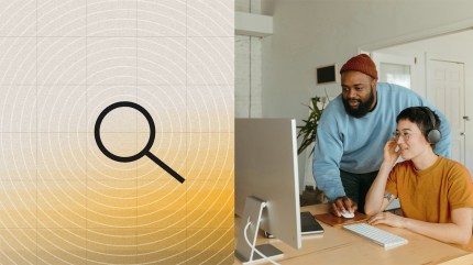 Two people collaborating at a desk with a magnifying glass icon representing headless CMS SEO.