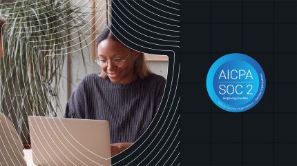 Woman smiling at laptop with a SOC 2 Type 2 badge on a blue and black graphic background.