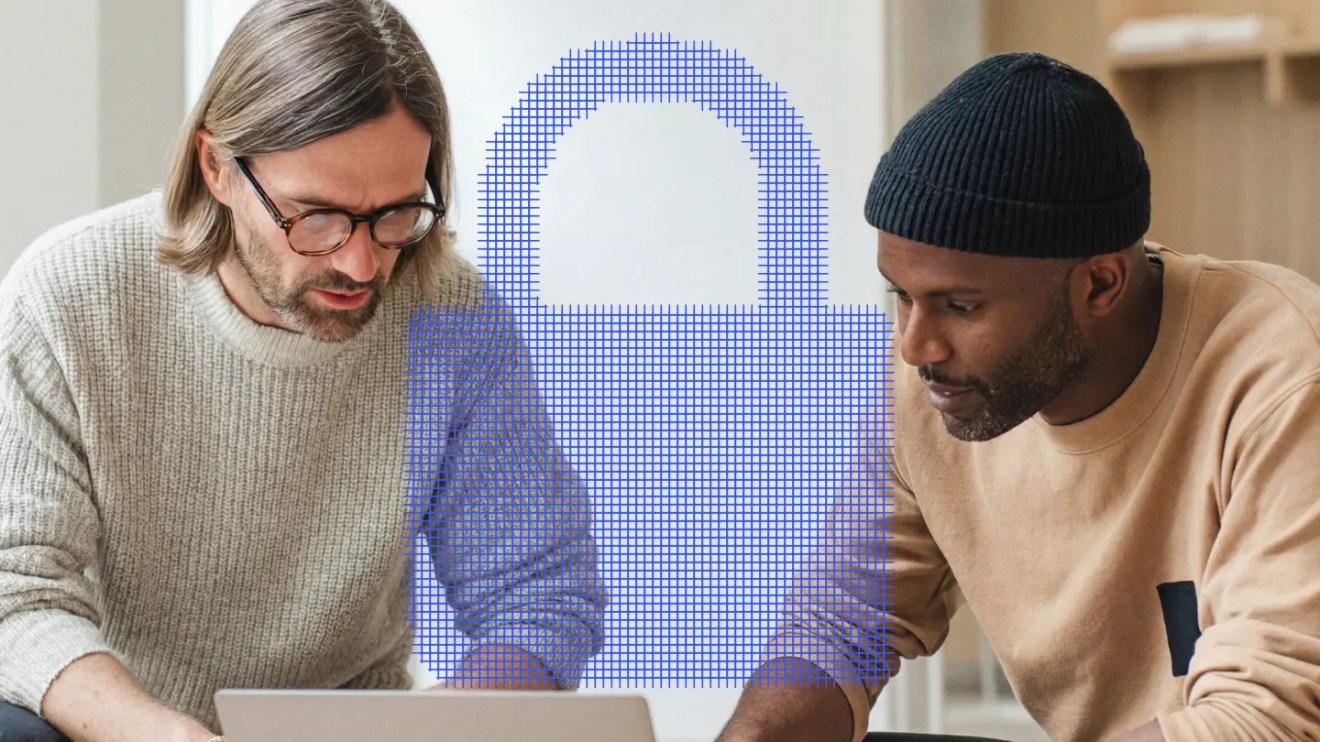 Two men reviewing How to Choose the most secure cms platform for Regulated Organizations on a laptop with a blue digital padlock graphic between them.