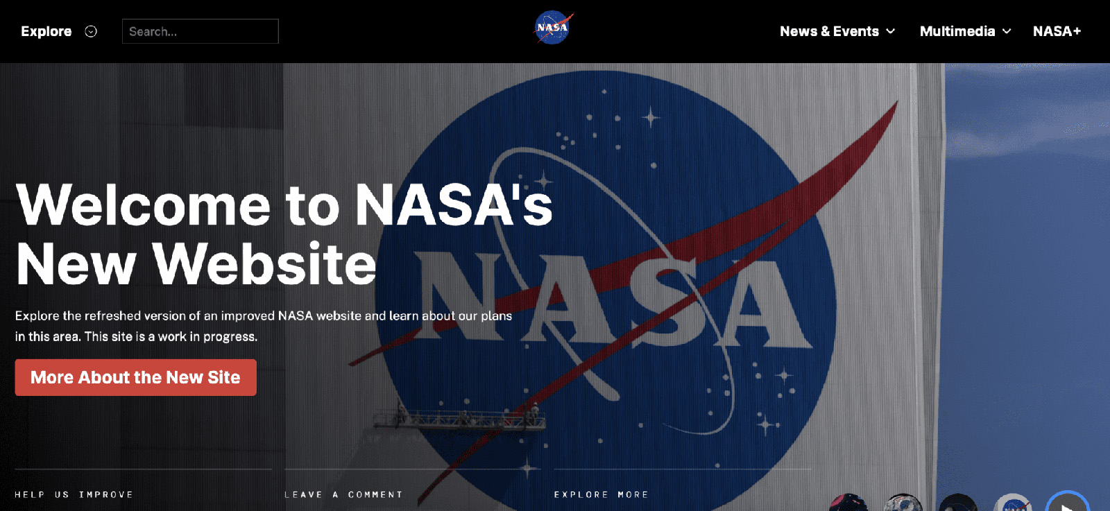 Screenshot of NASA’s new website homepage. The main banner features a large NASA logo and the headline “Welcome to NASA's New Website” in bold white text. Below it is a short description and a red button labeled “More About the New Site.” The background shows a close-up image of the NASA logo on a large flag or structure. The navigation bar includes options like "Explore," "News & Events," "Multimedia," and "NASA+."