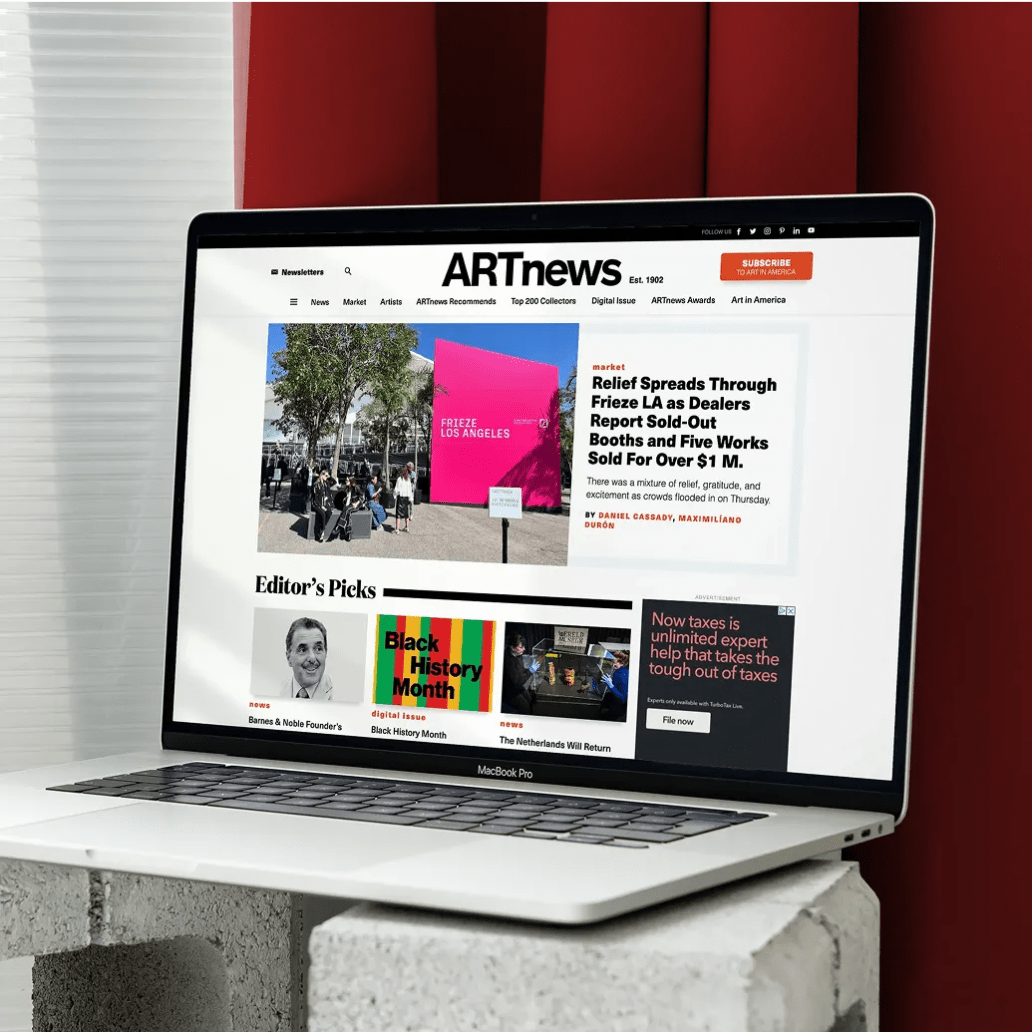 Laptop showing the ARTnews homepage with headlines, editor’s picks, and a feature on Frieze LA.