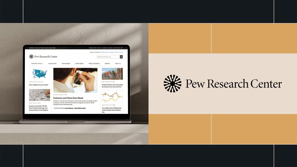 A laptop displaying the Pew Research Center website sits on a desk, showing articles and data visualizations. Next to it, the Pew Research Center logo and name are prominently displayed on a beige background with black and gold accent blocks.