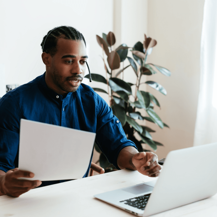 A man in a blue shirt looking at the powerful capabilities of Application Management at WordPress VIP