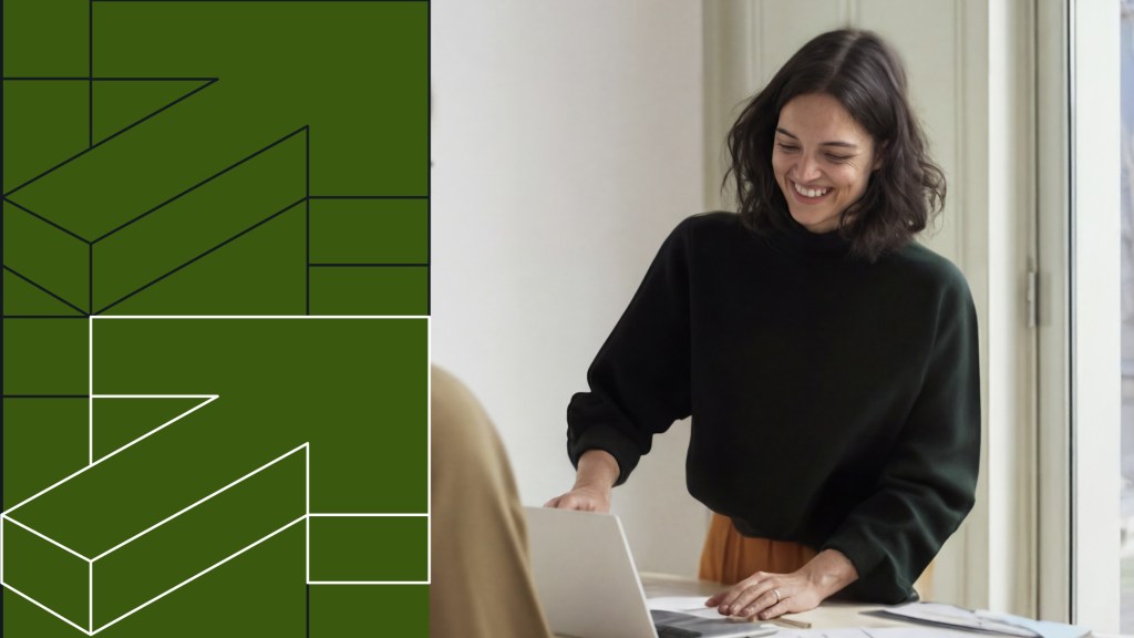 Enterprise content analytics visual showing a professional using a laptop alongside geometric data structures, representing measuring content performance at scale.