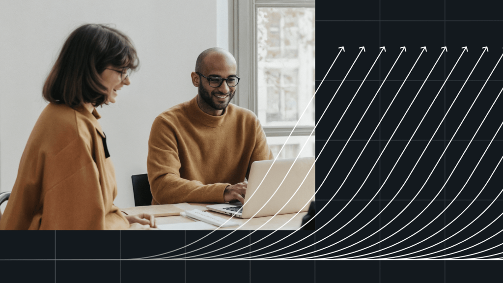 Two nonprofit team members collaborating at a laptop with upward growth graphics overlay, representing scalability and impact with WordPress VIP for Non Profits.